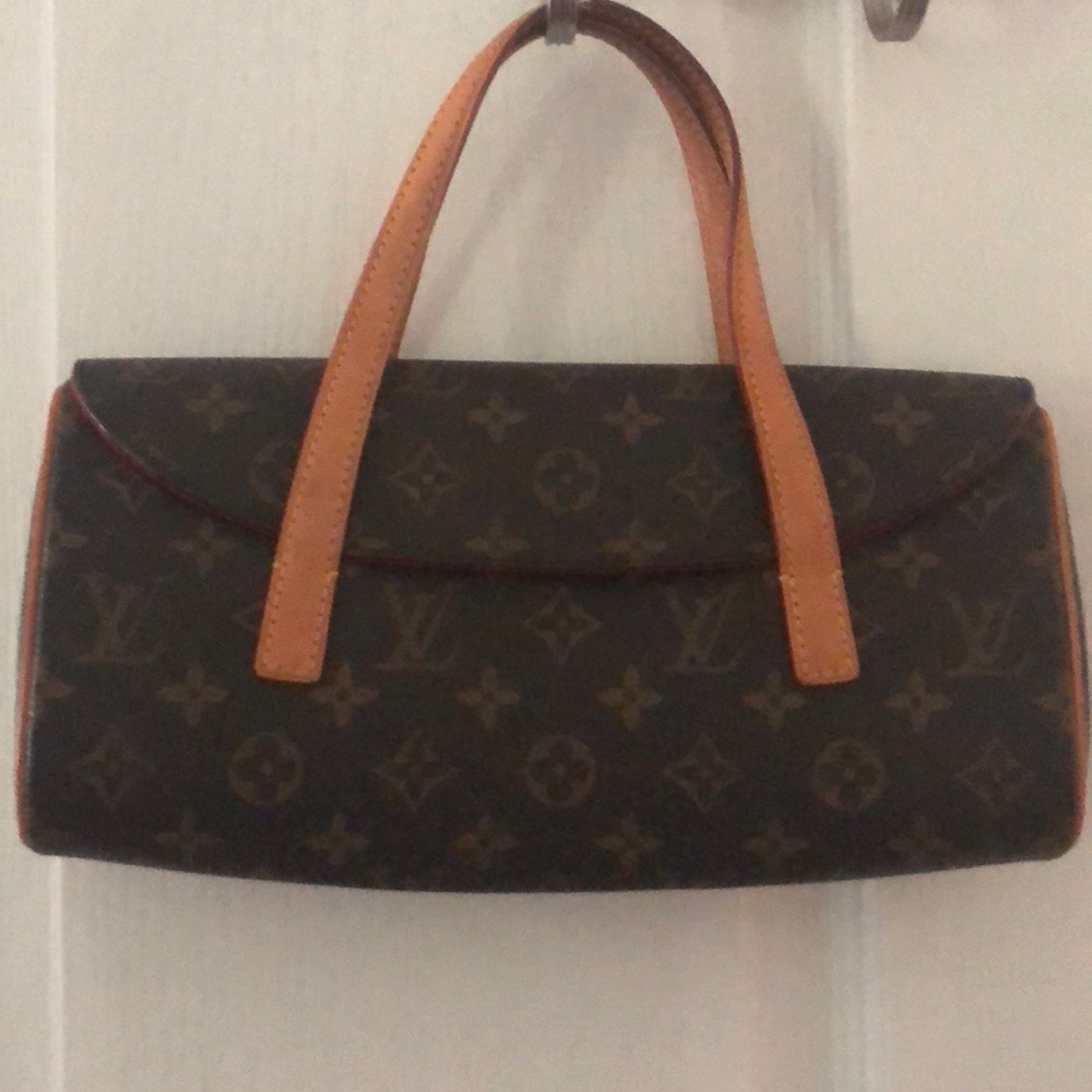 Authentic Louis Vuitton sonatine clutch satchel